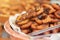 Delicious sweet dessert of Thai Traditional Style Donuts with chocolate on top homemade on rattan basket in wedding ceremony