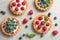 Delicious sweet pastries  berries on grey table, flat lay