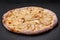 Delicious sweet pizza with pear, dorblu cheese and nuts