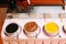 Delicious sweet sauces in black, red and yellow colors, assorted dishes. Greek cuisine