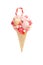 Delicious sweetmeats for children in the form of a waffle cone filled with candies, marshmallows and lollipops on a white backgrou
