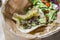 Delicious taco with guacamole and chapulines accompanied by a green salad