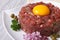 Delicious tartare closeup on a white plate. horizontal