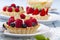 Delicious tartlets with fruit and cream mascaropne