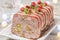 Delicious terrine with ground meat, ham and pistachios