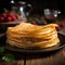 Delicious thin pancakes presented in a close up on wooden backdrop