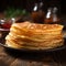 Delicious thin pancakes presented in a close up on wooden backdrop