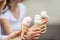 Delicious three ice cream in female hands - close-up