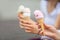 Delicious three ice cream in female hands - close-up
