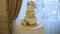 Delicious three-layer wedding cake is on the table