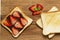 Delicious toast with fresh strawberries and chocolate paste on a wooden Board.