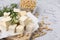 Delicious tofu cheese, rosemary and soybeans on light gray textured table, closeup