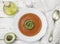 Delicious tomato soup with avocado, olive oil and spices