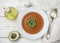 Delicious tomato soup with avocado, olive oil and spices