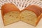 Delicious and traditional Brazilian homemade bread on wooden board. Perpendicular view. Close-up. Background with crochet towel