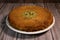 Delicious Traditional Dessert Knafeh with cheese and pistachios and orange flower syrup