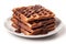 Delicious traditional Viennese waffles poured with liquid chocolate on white plate, isolated on white, close-up.