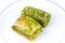 Delicious Turkish baklava and sarma with green pistachio nuts.