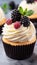 Delicious vanilla cupcake with berry decoration on charming table for a tempting morning breakfast