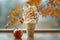 Delicious Vanilla Ice Cream Cone with Caramel Drizzle and Autumn Leaves Background