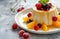 Delicious vanilla panna cotta with fresh berries and fruit coulis