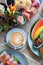 Delicious and various  delicacies with veggies, fruits and a cup of latte