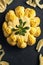 Delicious vegan cauliflower cheese on dark background, top view. Generative AI