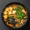 Delicious Vegan Ramen Bowl: A Steaming Delight of Noodles, and Nori in Savory Broth. Ai generated