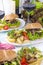 Delicious vegetarian burgers and potatoes for two. Lunch and wine. Light background and space for text. Dietary food. copy space