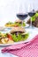 Delicious vegetarian burgers and potatoes for two. Lunch and wine. Light background and space for text. Dietary food. copy space