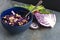 Delicious vegetarian dinner or snack with red cabbage,dill,onion rings,nuts.Served on rustic grey dark table