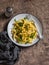 Delicious vegetarian lunch - pasta with pumpkin sauce and arugula.