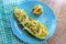 Delicious vegetarian meal, stuffed mac and cheese zucchini and mushrooms, on the round plate