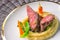 Delicious venison steak with potatoes mash and vegetables on white plate, product photography for exclusive restaurant