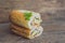 A delicious Vietnamese Bahn Mi sandwich on a wooden background