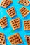 Delicious waffles on a blue background