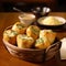 Delicious warm garlic rolls in a basket.