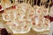 delicious white pops with icing at candy bar with sweets and drinks at luxury wedding reception. catering at restaurant. space