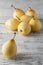 Delicious Williams or Bartlett pears on a rustic wooden kitchen