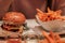 A deliciouse burger with sweet potaot fries. closezup, wallpaper, roasted, beef, salat;