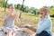 Delighted aged woman looking at the soap bubbles