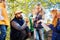 Delighted bearded man sitting in the circle of children