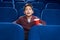 Delighted boy watching interesting film in cinema