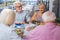 Delighted elderly people enjoying their meal together