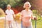 Delighted elderly woman walking with her husband