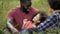 Delighted father holding little daughter and playing with her curly hair, care