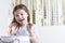 Delighted girl and birthday cake