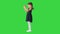 Delighted girl in black dress clapping her hands on a Green Screen, Chroma Key.