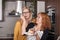 Delighted girlfriends eating cake in the kitchen