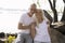 Delighted man and woman on the rocks stock photo